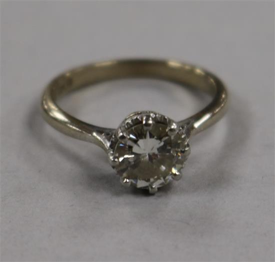 An 18ct gold and platinum solitaire diamond ring, size M.